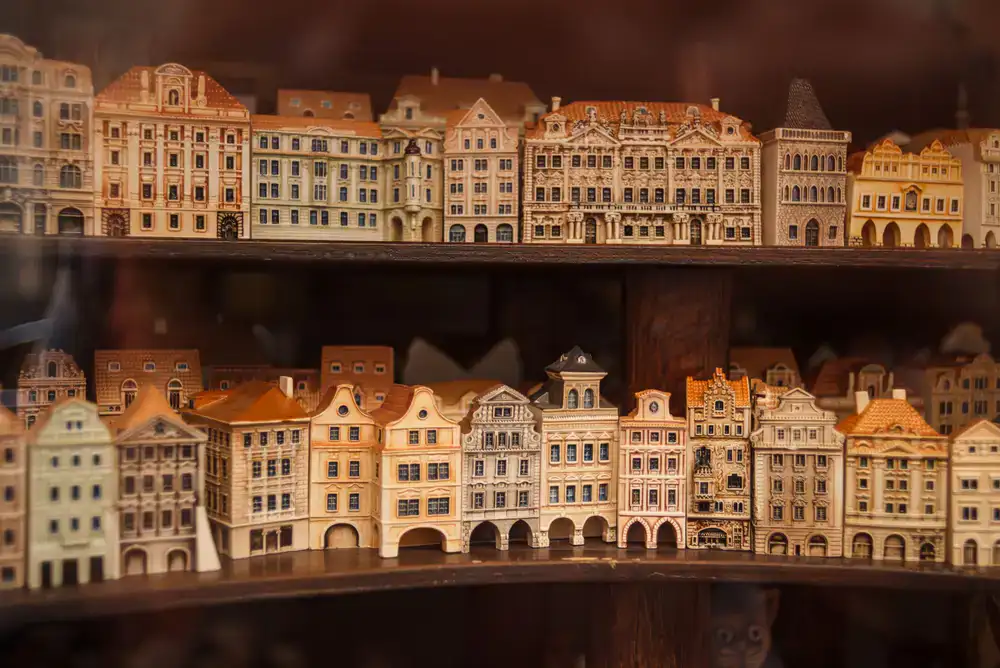 Unpainted miniature models displayed on a shelf