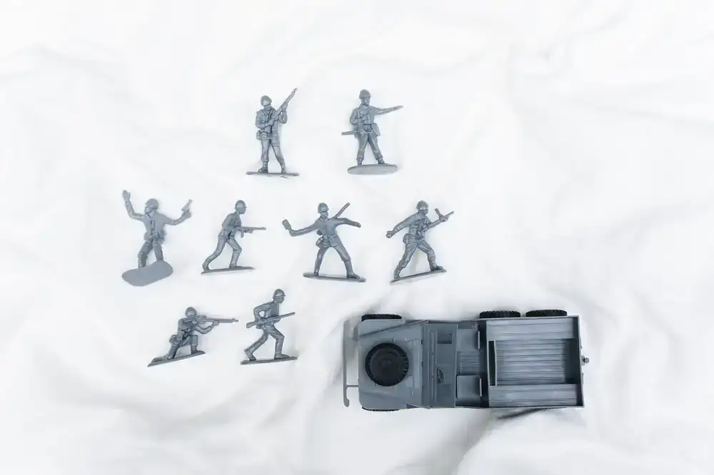 Unassembled grey plastic miniature sprue in a box