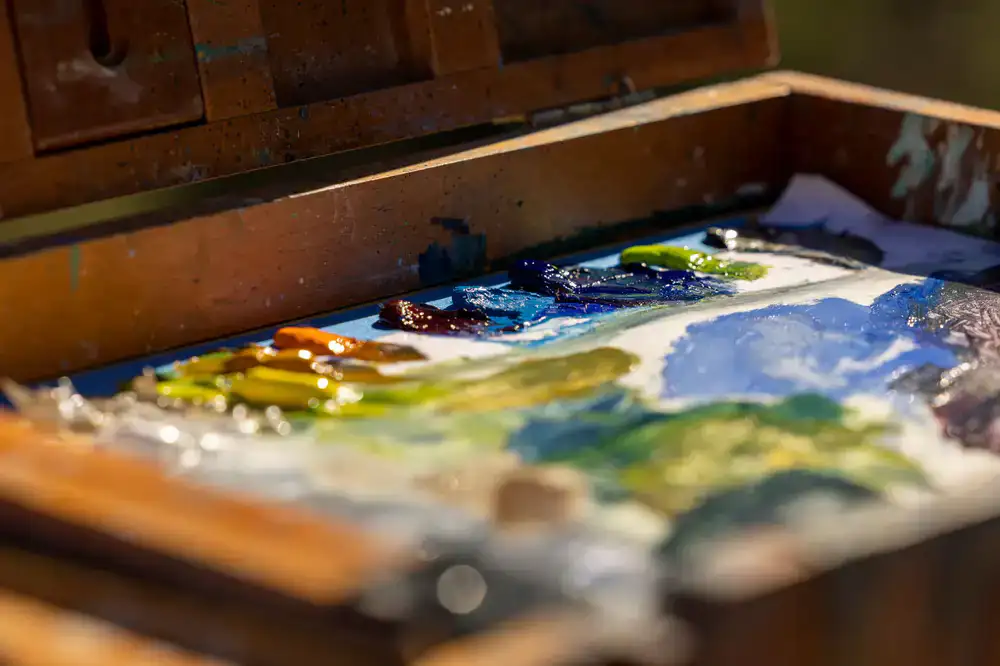 A complete hobby starter kit box open with paints and tools inside