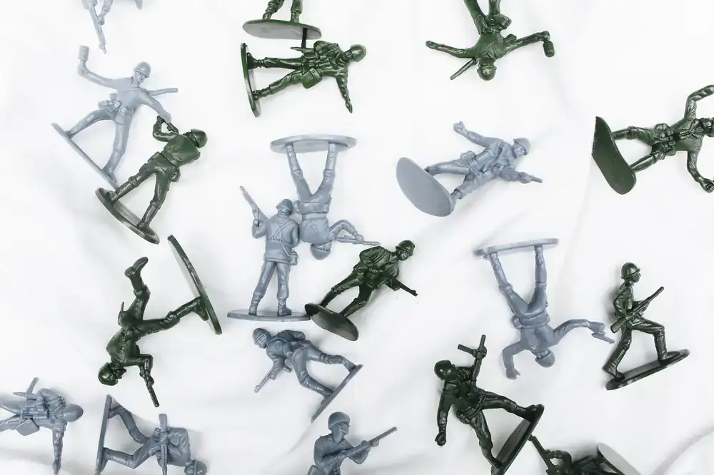 Miniature model being primed in grey